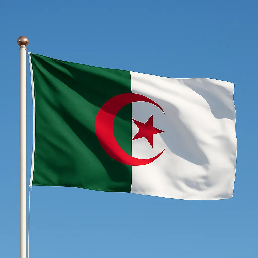 Flag of Algeria with green, white, and red design against a clear blue sky