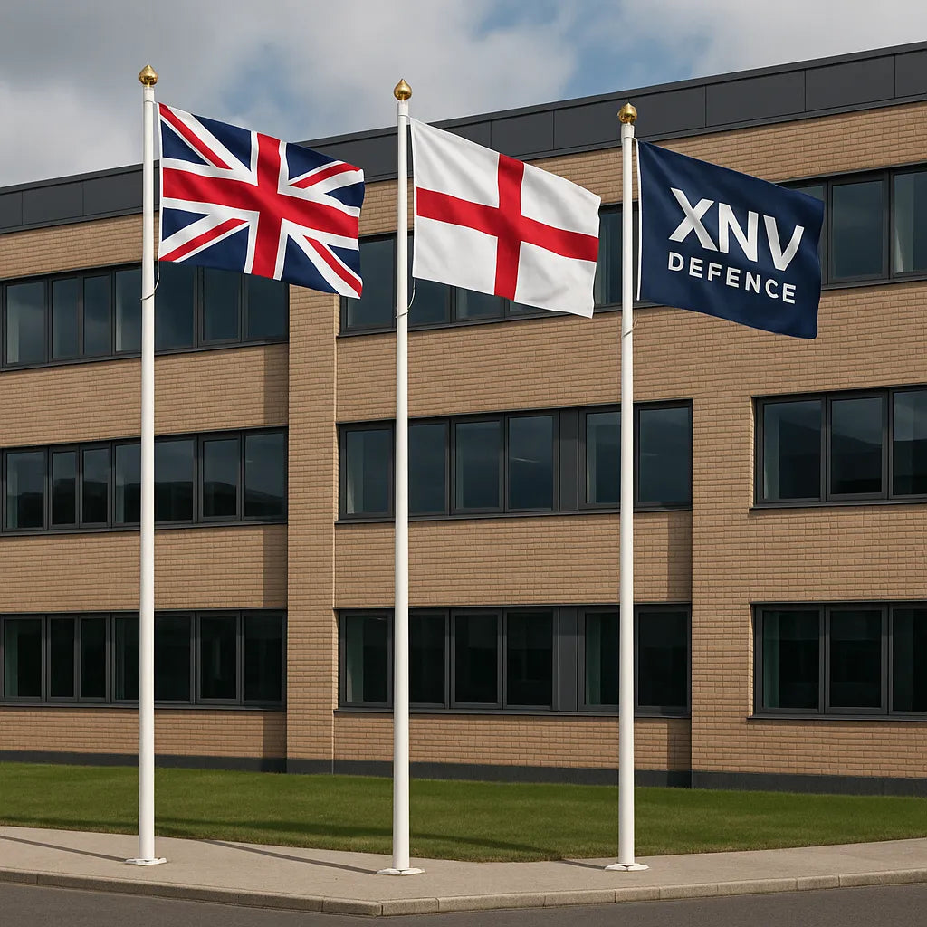 Glassfibre flagpole with hinged base – durable white fibreglass pole with high-gloss finish, shown with flag fluttering against blue sky.
