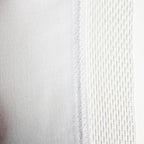 Close-up of a textured sewn Union Flag  with antifray netting with subtle variations in colour.