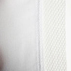 Close-up of a textured sewn Union Flag  with antifray netting with subtle variations in colour.