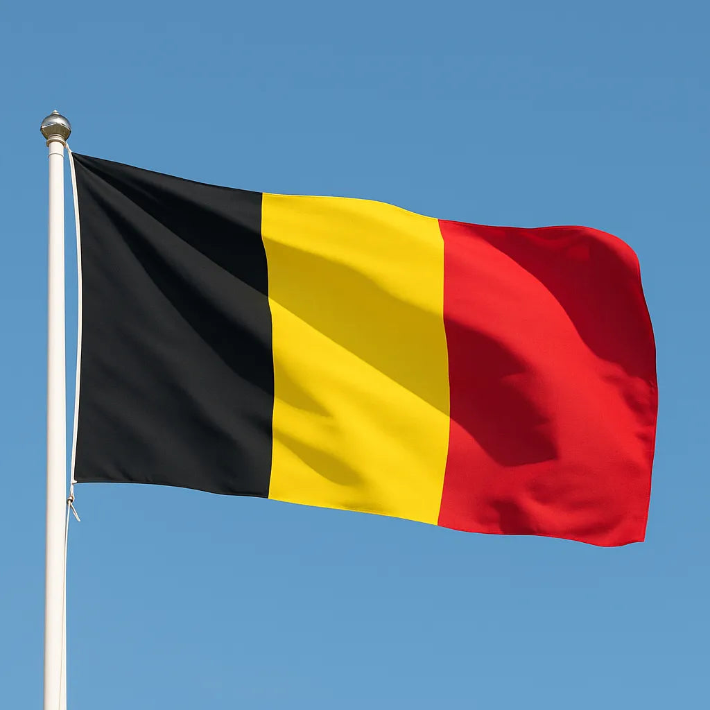 Flag of Belgium waving against a clear blue sky