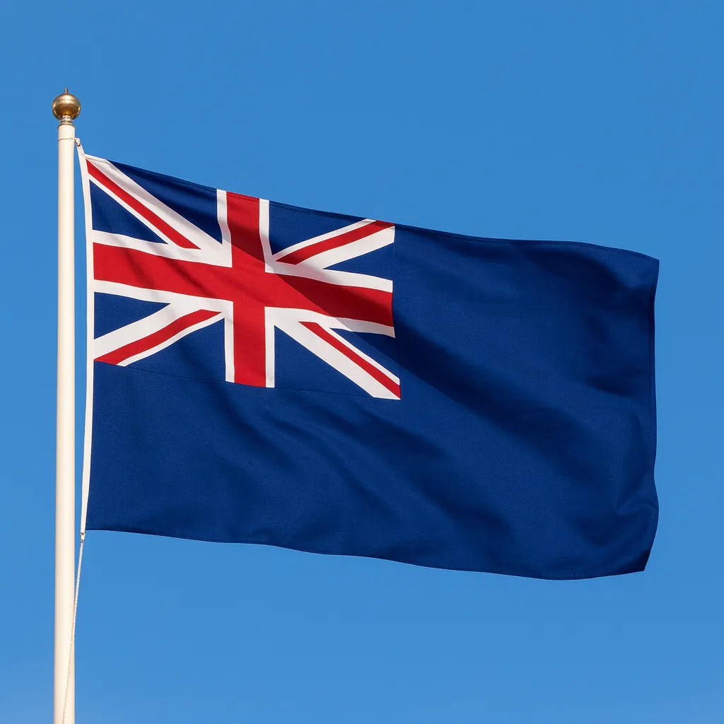 Union Jack flag on a pole against a clear blue sky