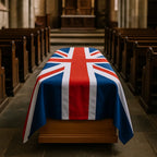 Casket draped with a Union Jack flag in a church setting