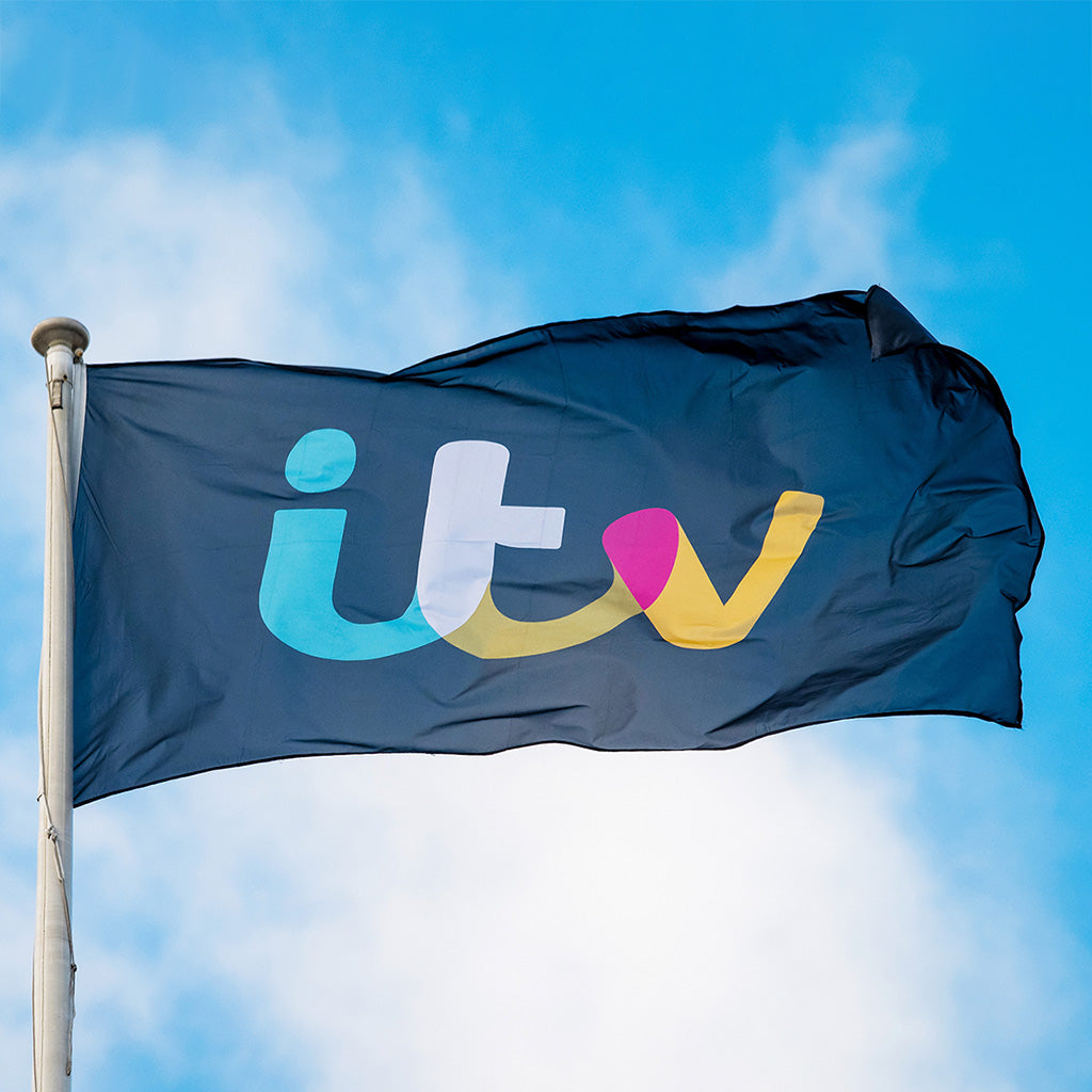 Flag Flying on a flagpole on a sunny day