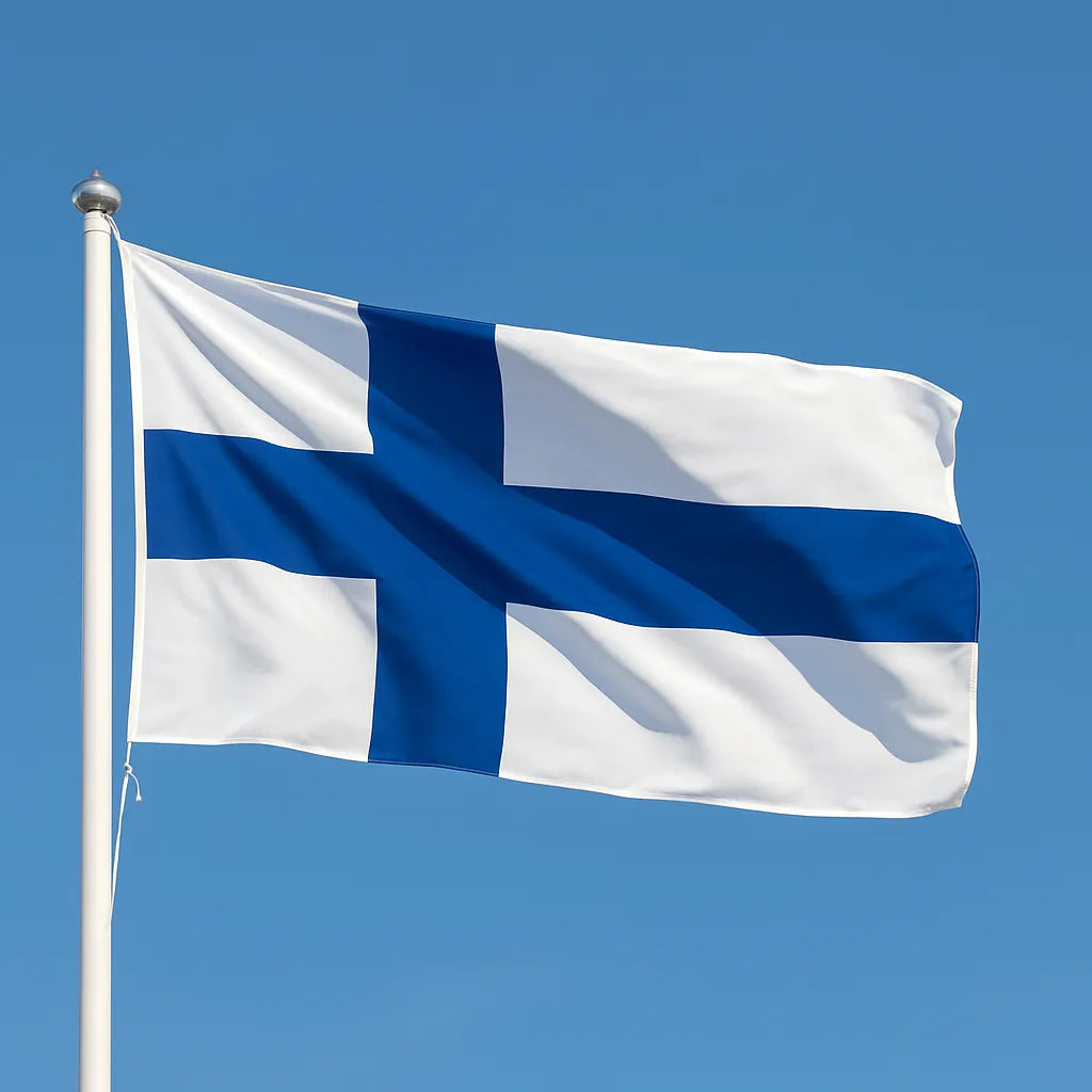 Finland Flag with blue and white cross design against a clear blue sky