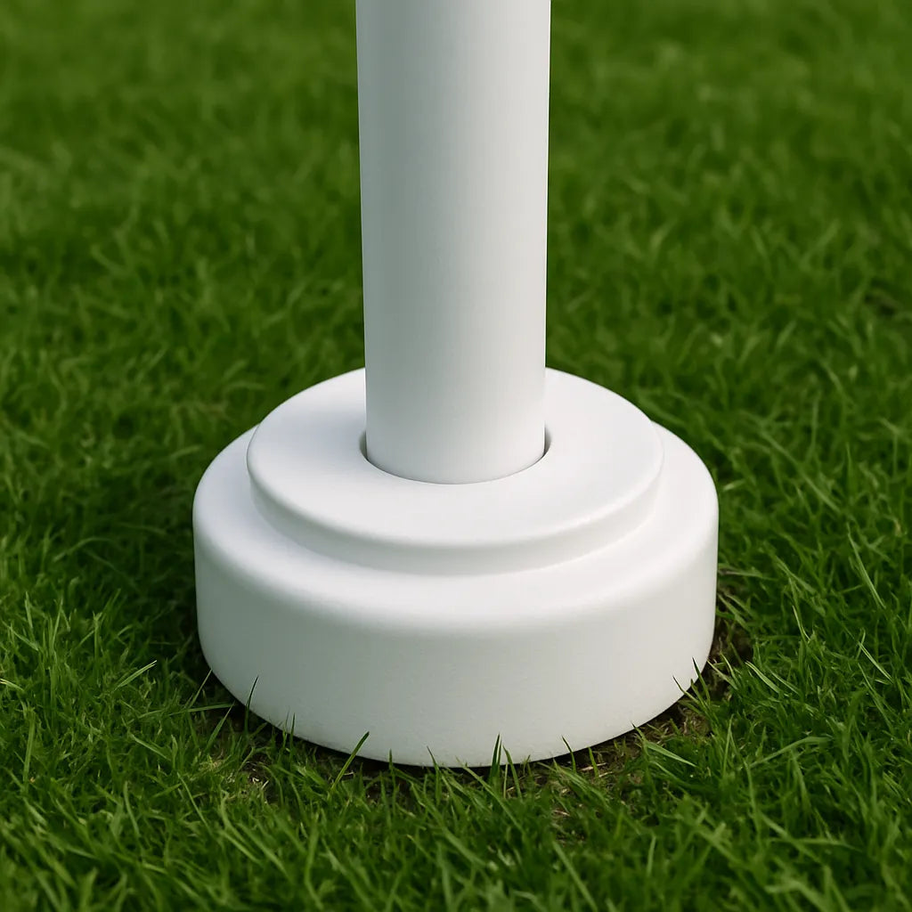 White base and pole on grass