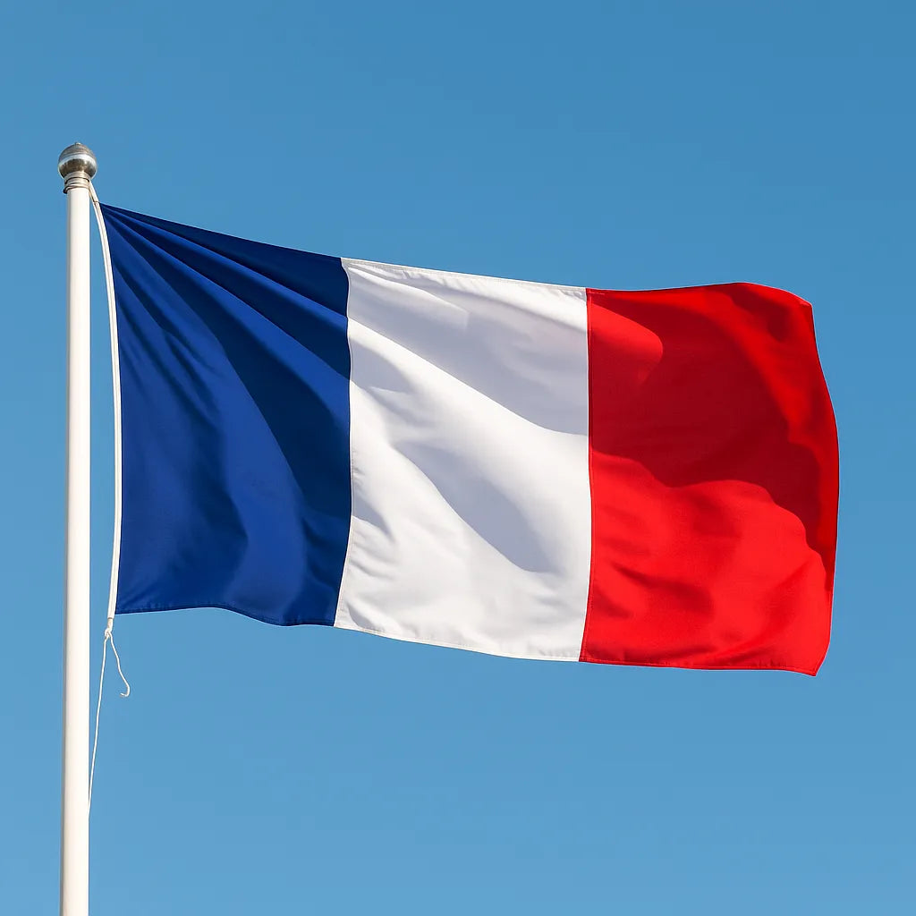 French Flag flying on a blue sky