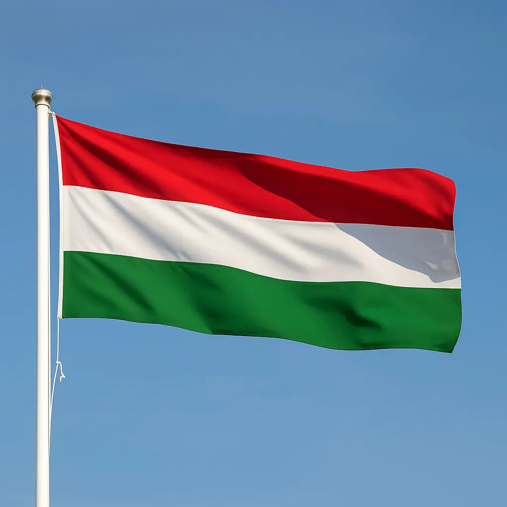 Hungary Flag flying on a flagpole on a blue sky