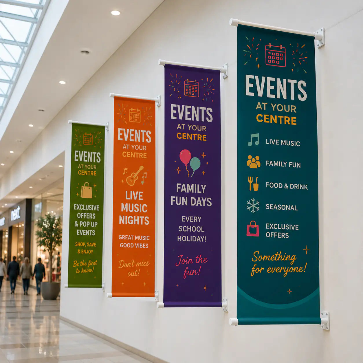 Colourful event banners mounted on a wall in a shopping centre