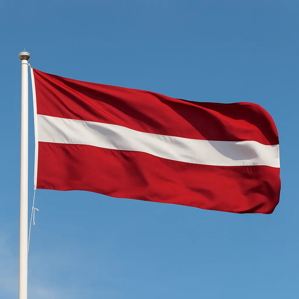Latvia flag waving against a clear blue sky