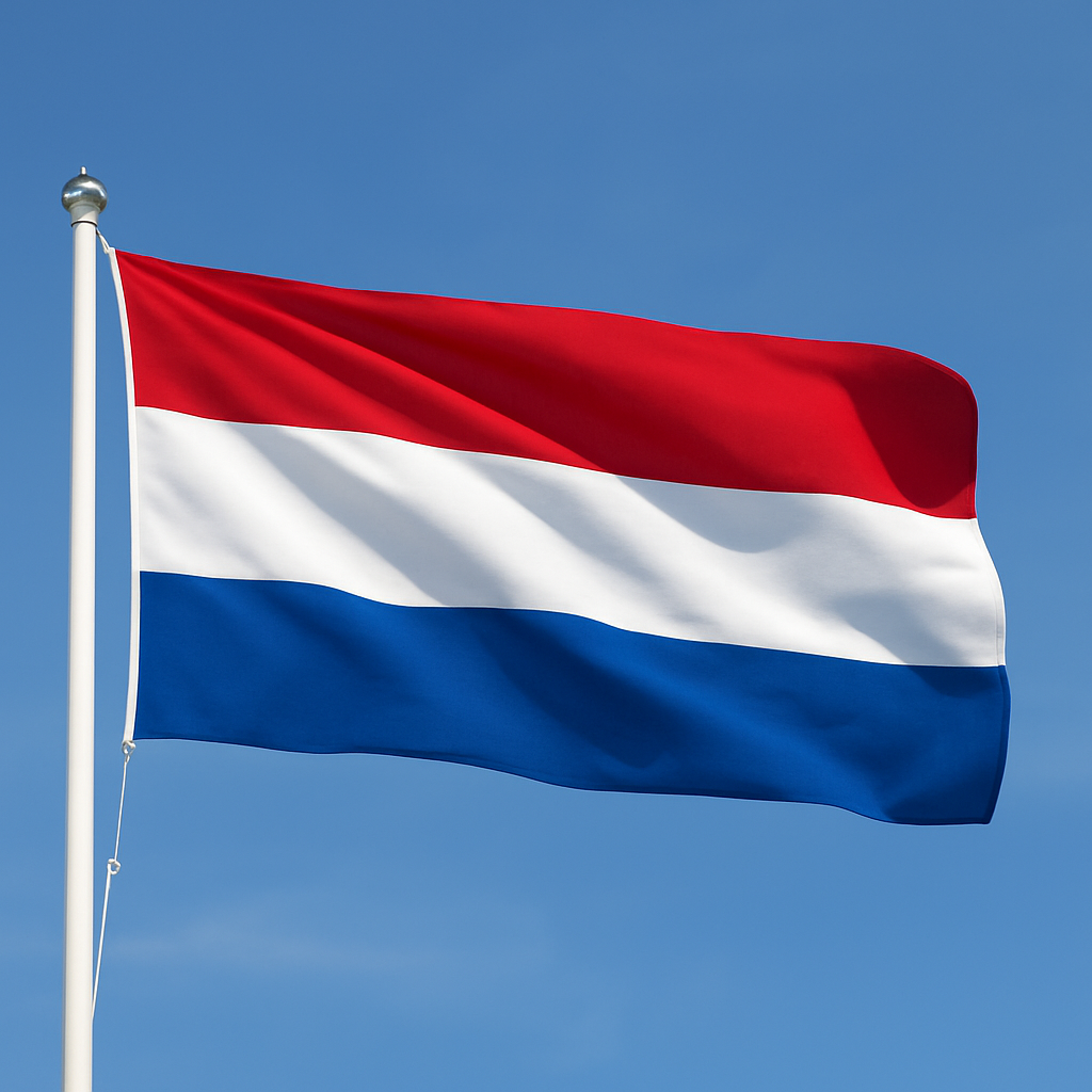 Netherlands flag waving against a clear blue sky