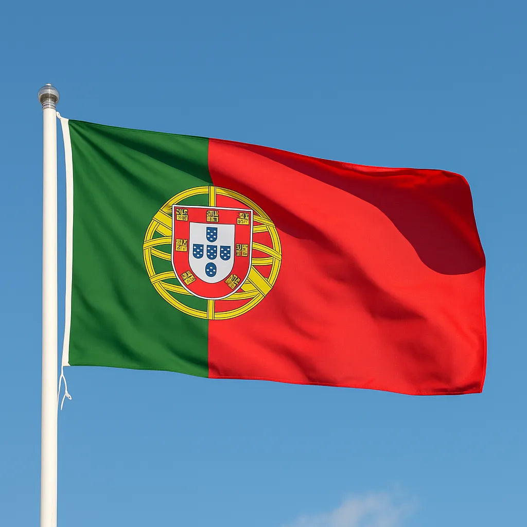Portuguese flag waving against a clear blue sky