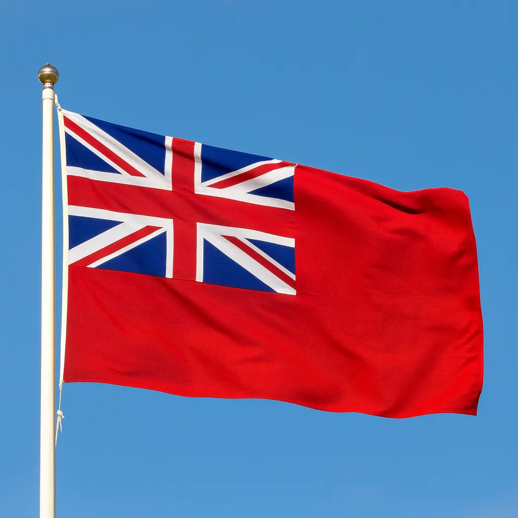 Red Ensign flag with Union Jack against a clear blue sky