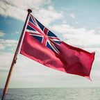Red Ensign Flag flag being flown on the back of a boat.