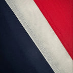 Close-up of a Sewn Union Jack Flag with a white stripe on a red and navy background