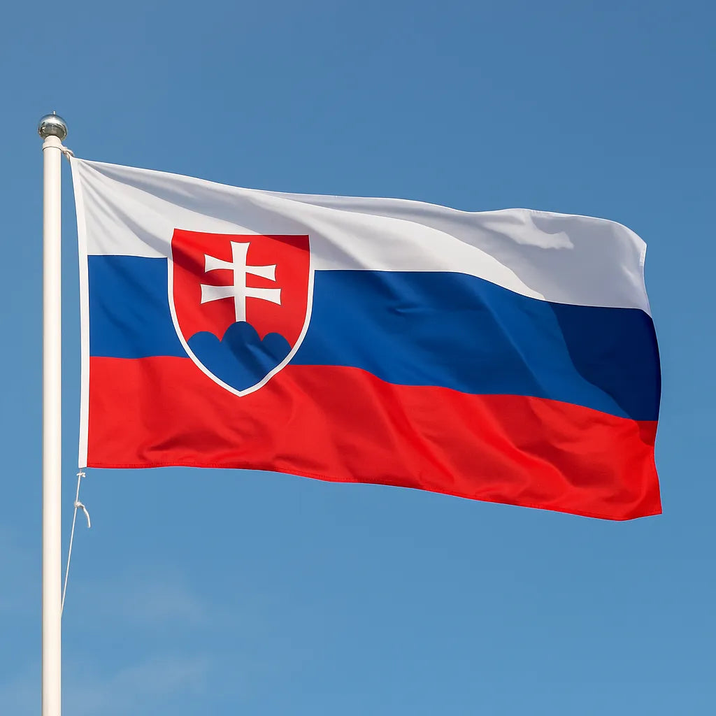 Slovak flag waving against a clear blue sky