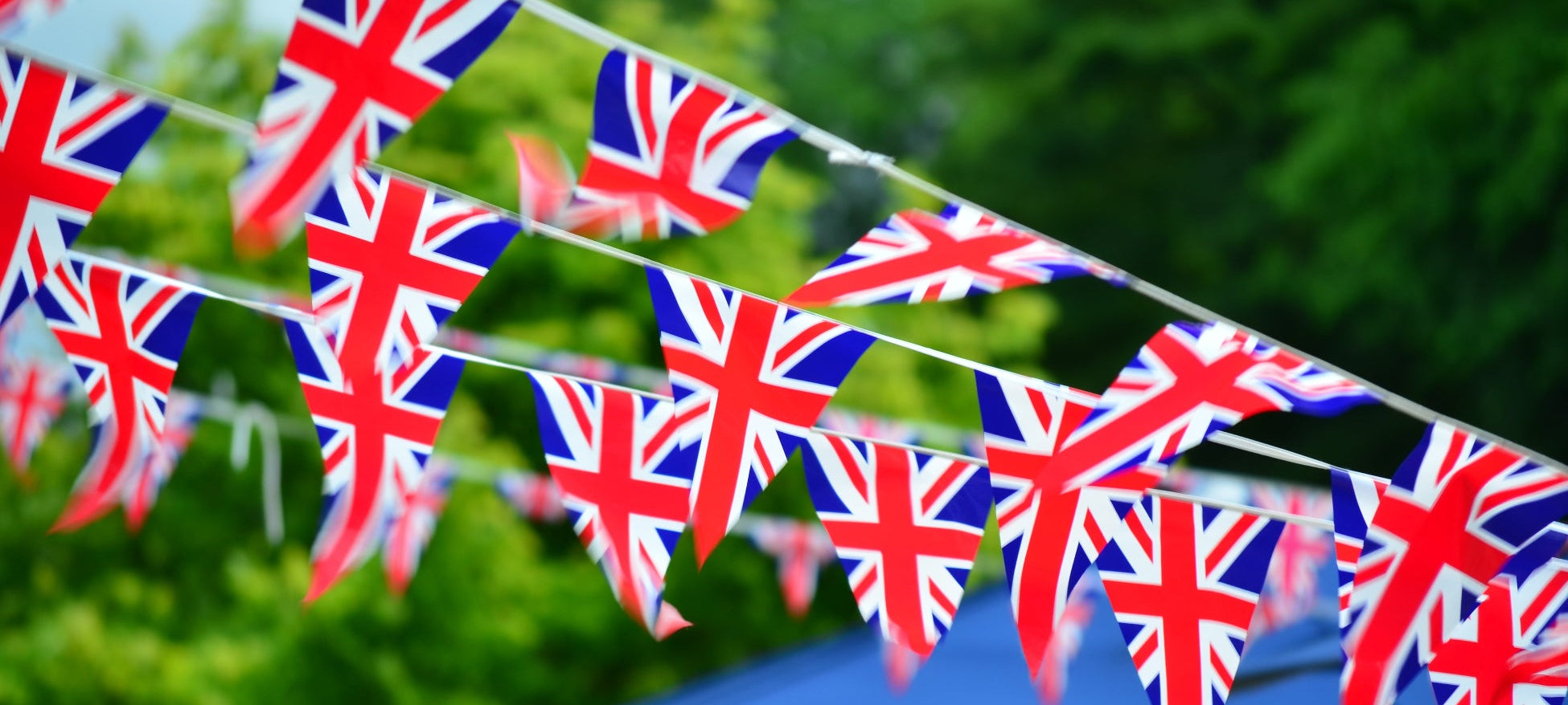 Union Jack bunting against a green outdoor background